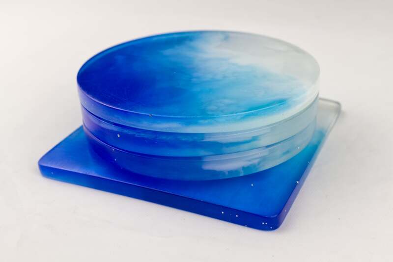 Capture the Serenity of the Ocean with our Waves Resin Coaster Set - 3 Round and 1 Square Coasters for Stylish Home Decor. Available now on Etsy