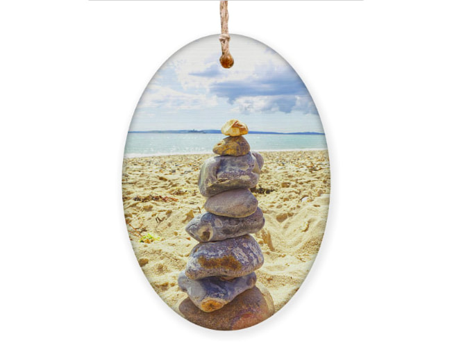 Bring the tranquility of Bournemouth Beach into your home with this captivating ornament. Discover the artistry of rock balancing and find your own sense of balance and harmony. Adorn your space with the beauty of nature and the peacefulness of the coast. Elevate your decor with the 'Finding Balance' ornament from Fine Art America.