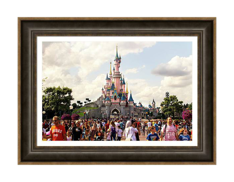 Explore the Enchanting Beauty of Sleeping Beauty's Castle at Disneyland Paris, looking down Main Street over a crowd of people -  Framed Art Print of Sleeping Beauty's Castle - Fine Art America Print, Disney Castle Artwork, Magical Fairytale Wall Decor