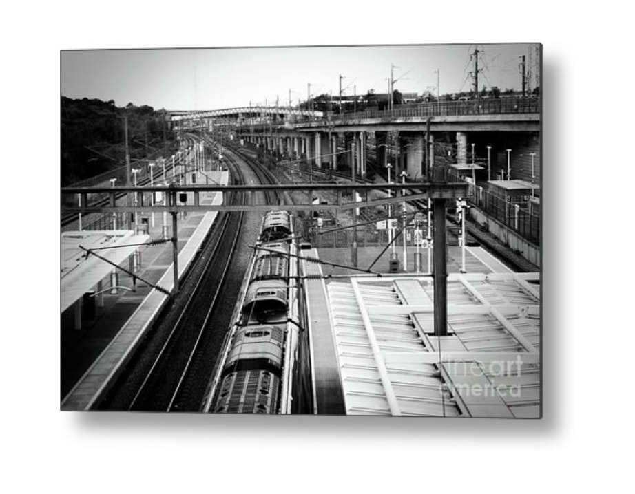 Captivating black and white metal print of 'Journey Through Time: Ebbsfleet Train Station' available on Fine Art America– experience the historic charm and architectural beauty. Add sophistication to your space with this stunning artwork.